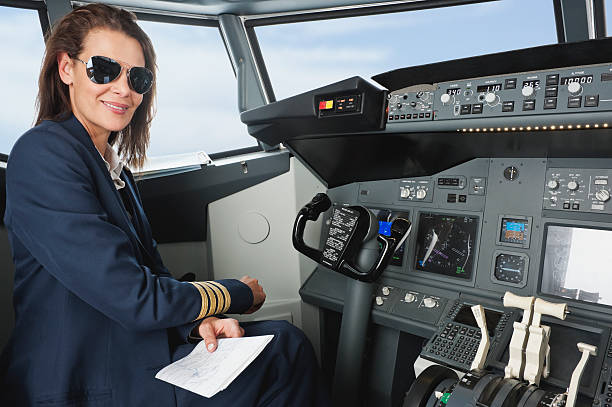istock Female pilot with map in airplane cockpit 527636427