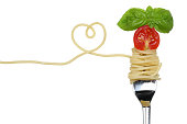 Spaghetti noodles pasta meal with heart on fork love topic