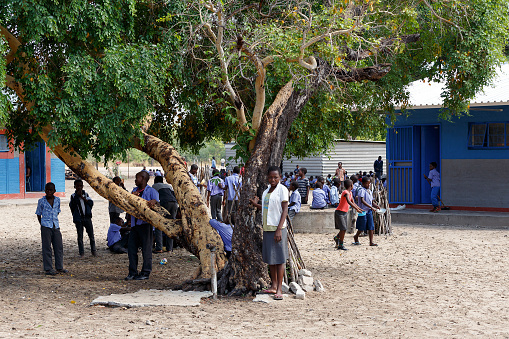 Kavango,Namibia - October 15, 2014: Happy Namibian school children waiting for a lesson. Kavango was the region with the highest poverty level in Namibia, more than 50% of the population were classified as poor. 