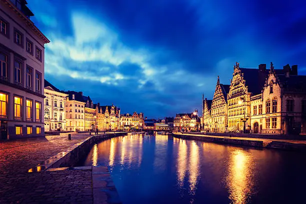 Photo of Ghent canal, Graslei and Korenlei streets in the evening. Gent