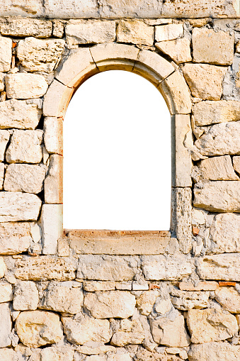 Arched window in a stone wall
