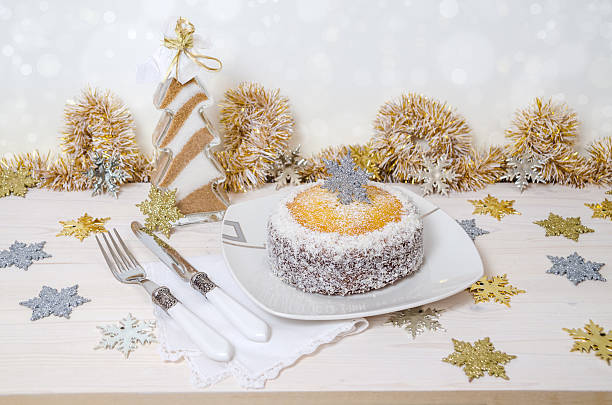 istock Festive pumpkin cake on table and Christmas decoration. Background bokeh 527660773