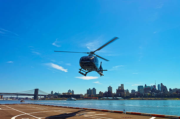 istock Helicopter and Brooklyn bridge and Manhattan bridge over East River 527662218