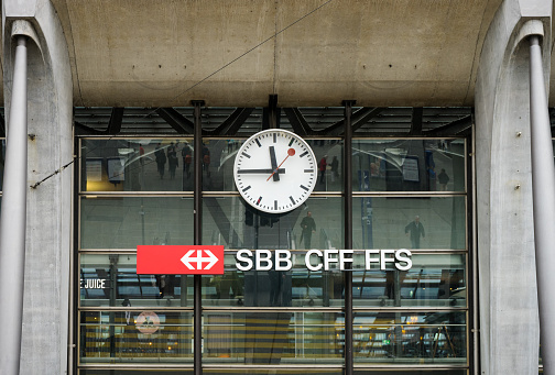 Lucerne, Switzerland - April 13,2016 : Logo of Switzerland railways in Lucerne train station with the clock.