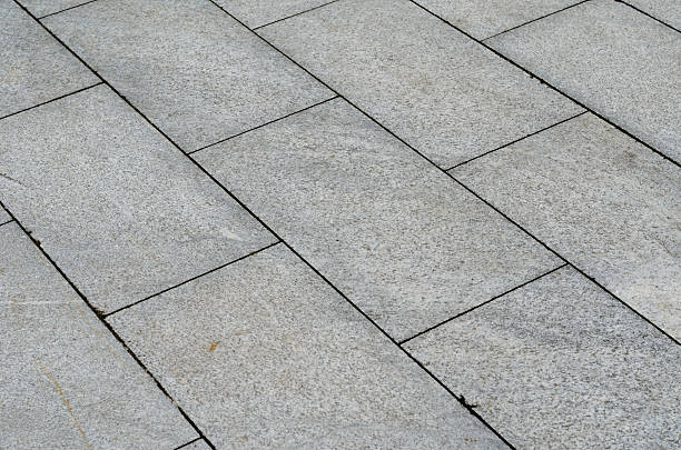 istock Gray brick pavement in the city 527664004