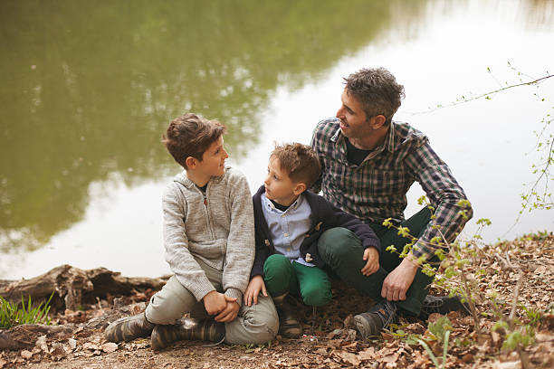 istock Father and sons enjoying in the nature 527664344