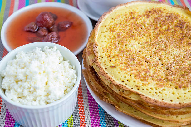 istock Pancakes with strawberry jam, cheese . 527665324