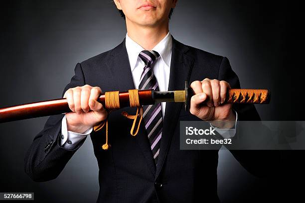 Businessmen Have A Samurai Sword Black Background Stock Photo - Download Image Now - Adult, Aggression, Black Background