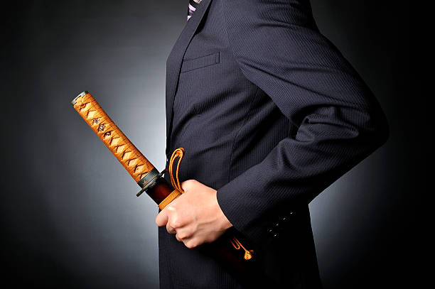 istock Businessmen have a Samurai sword, black background 527667394
