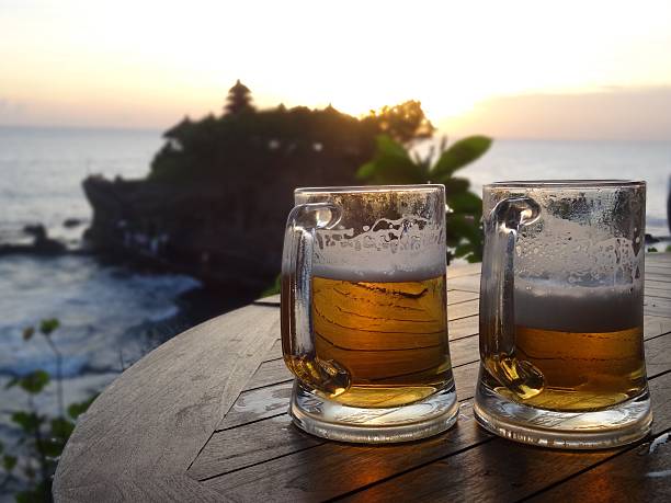istock Beer at sunset - Tanah Lot Temple, Bali 527669306