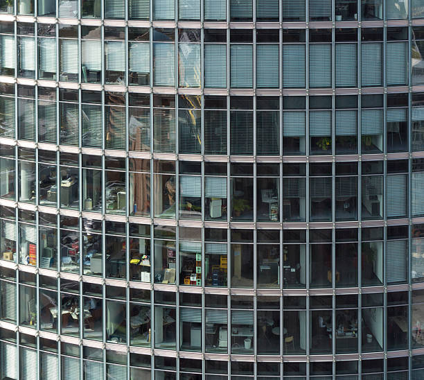 istock Curved glass facade of a modern office block 527669386