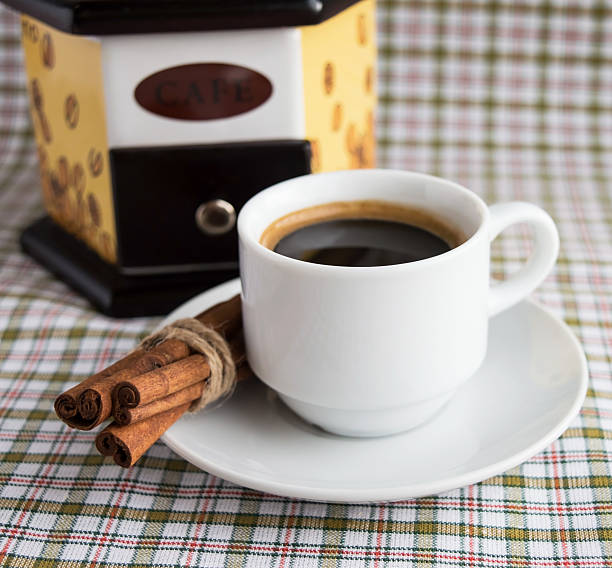 istock Cup of coffee and coffee mill 527669914