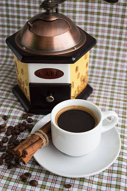istock Cup of coffee and coffee mill 527669944