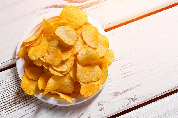 Photo of Potato chips pile on plate.