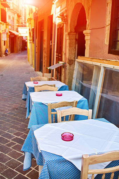 istock Empty tables of street cafes 527673436