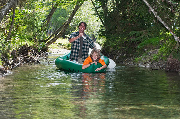 istock Austria, Salzburger Land, Father and son, canoeing 527675725
