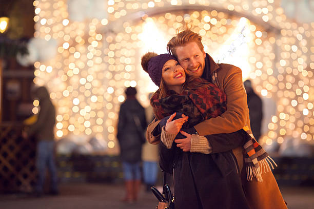 istock Couple having fun outdoors at winter fair. 527676603