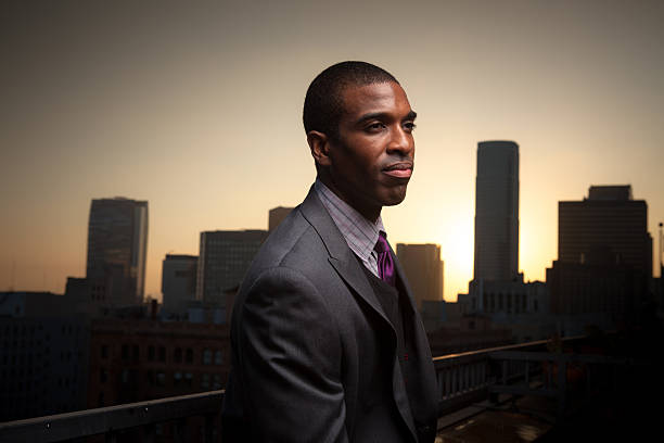 istock Thoughtful Young Professional Overlooking Downtown at Sunset 527677919