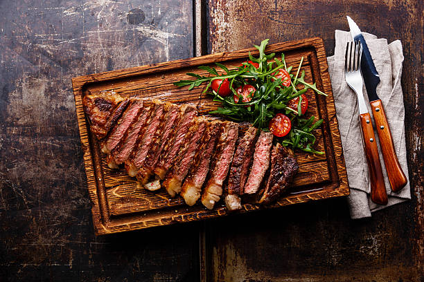 istock Sliced grilled steak and salad 527677934