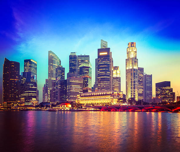 istock Singapore skyline and river in evening 527677947
