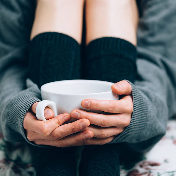 istock Cup of coffee in woman's hands 527678391
