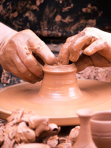 istock hands of a potter 527678729
