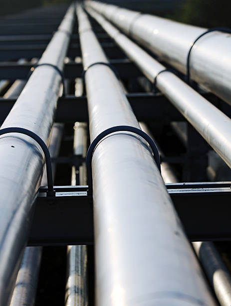 long steel pipe in oil refinery station stock photo