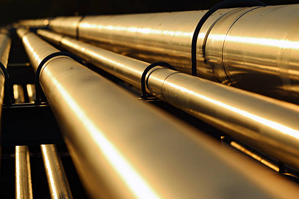 istock golden steel pipeline during sunset 527678943