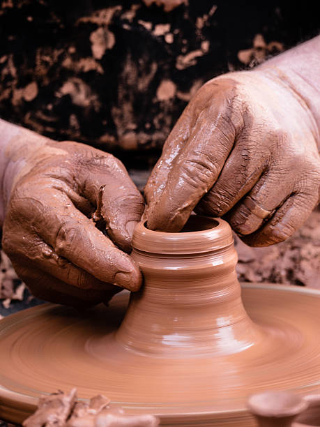 istock hands of a potter 527678989