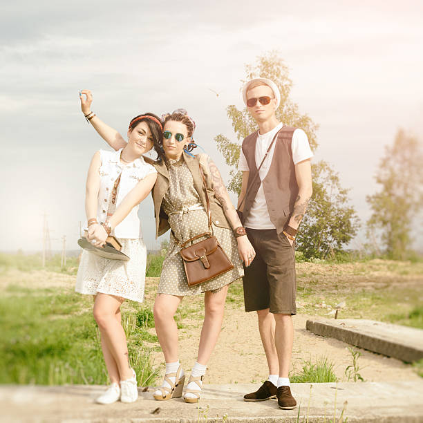 young active girls and guy hipsters of have fun outdoors summer