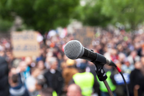 istock Political protest. Public demonstration. Microphone. 527680242
