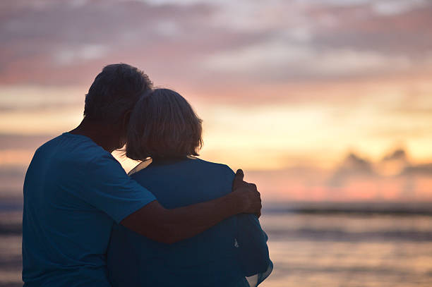 istock elderly couple rest at tropical beach 527680906