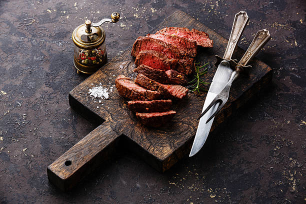 istock Sliced steak roastbeef with knife and fork 527681742