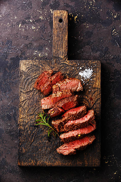 istock Sliced grilled steak roastbeef and rosemary 527681770