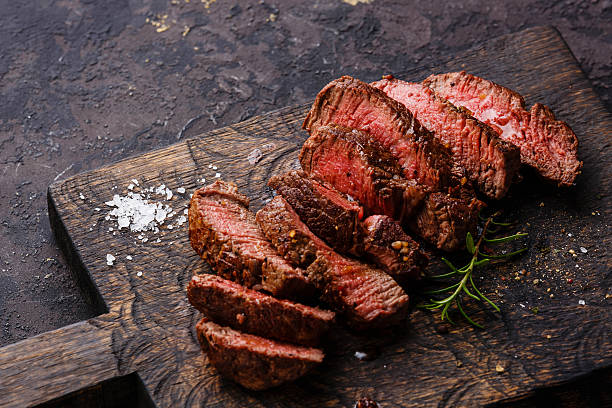 istock Sliced grilled steak roastbeef and rosemary 527681780