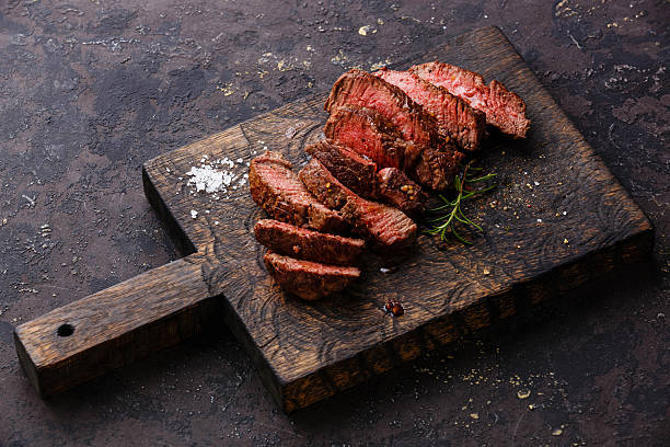 istock Sliced grilled steak roastbeef and rosemary 527681796
