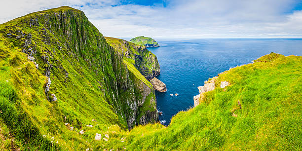 istock Green island cliffs blue ocean St Kilda Outer Hebrides Scotland 527682116