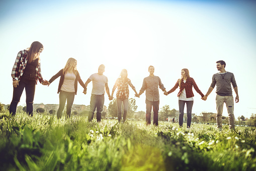 Friends together holding hands