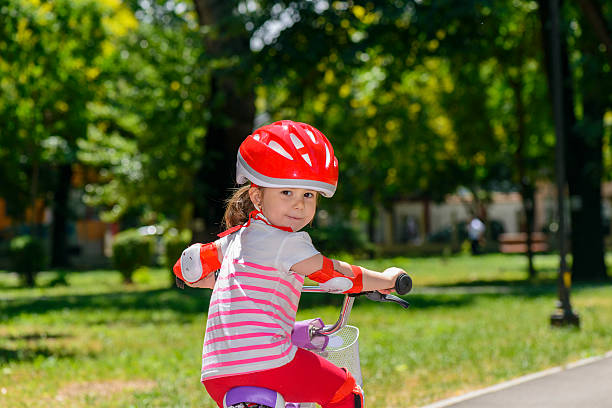 istock Little girl riding a bicycle 527683988