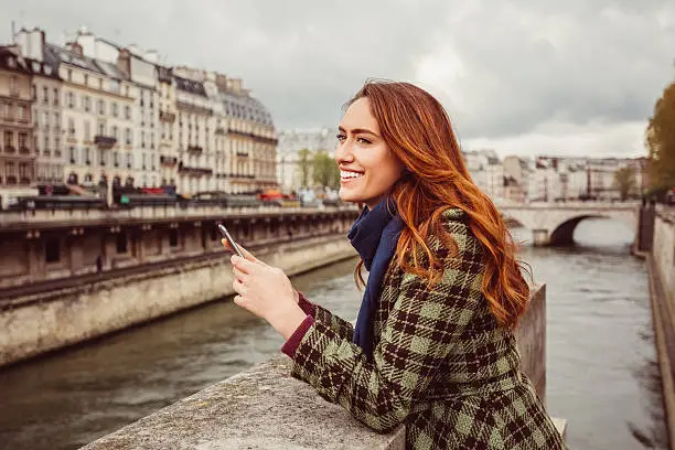 Photo of Woman at Seine river texting