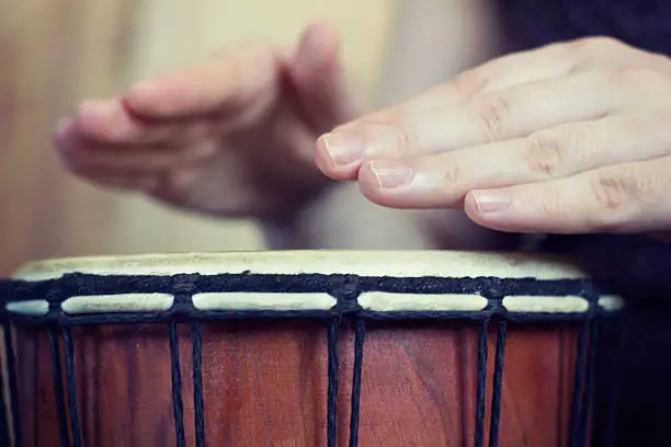 Playing the djembe