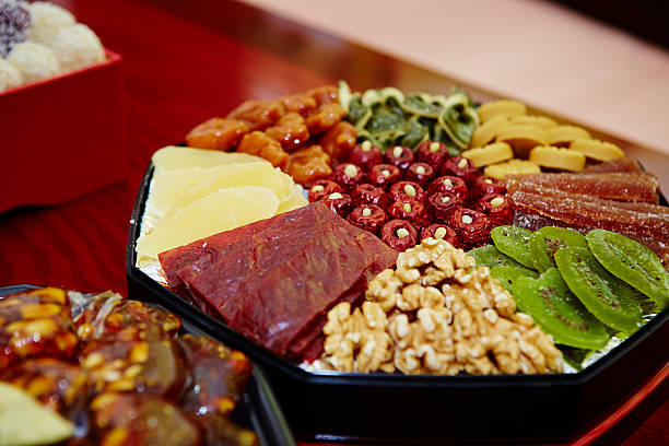 Black garlic on dish, wooden backgroundKorean traditional marriage cuisine setting