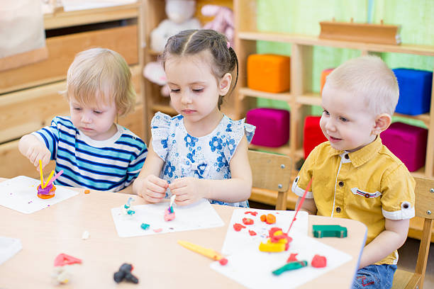 istock kids learning arts and crafts in kindergarten 527686786