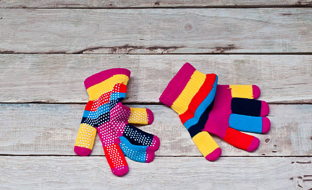 istock Colorful glove on wood. 527687180