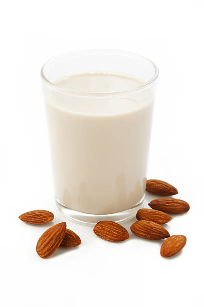istock almond milk in glass with almonds 527687868