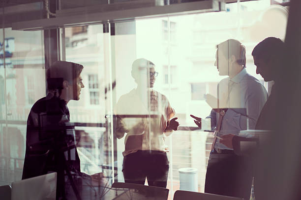 istock Business people having discussion in modern office 527689700