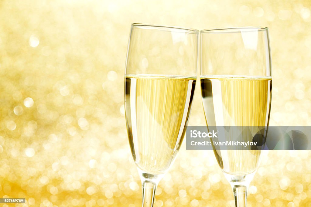 Champagne glasses Champagne glasses on abstract shiny glitters background Alcohol - Drink Stock Photo