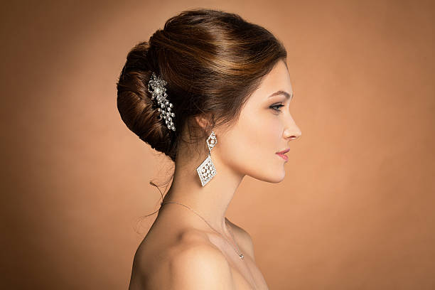 istock Beautiful sensual brunnete with elegant hairstyle. Wedding accessories 527690202