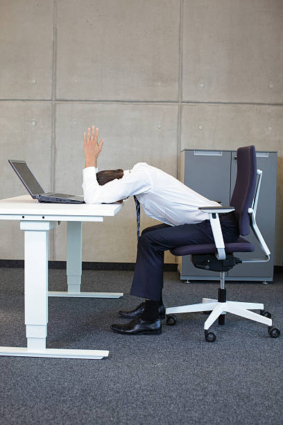business man arms-back stretching on the table