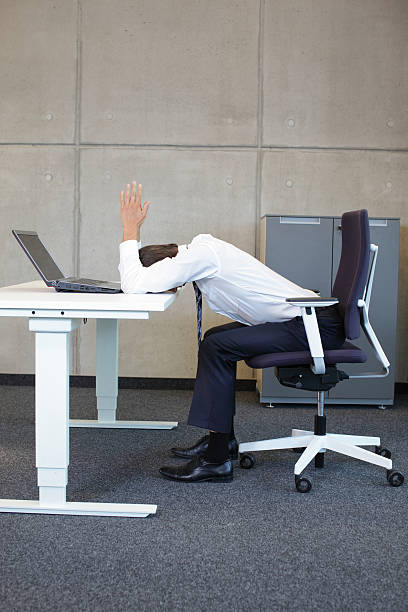 business man arms-back stretching on the table stock photo